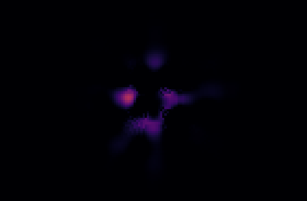 After azimuthal subtraction: the ring is gone, leaving only a few faint blobs near the centre.